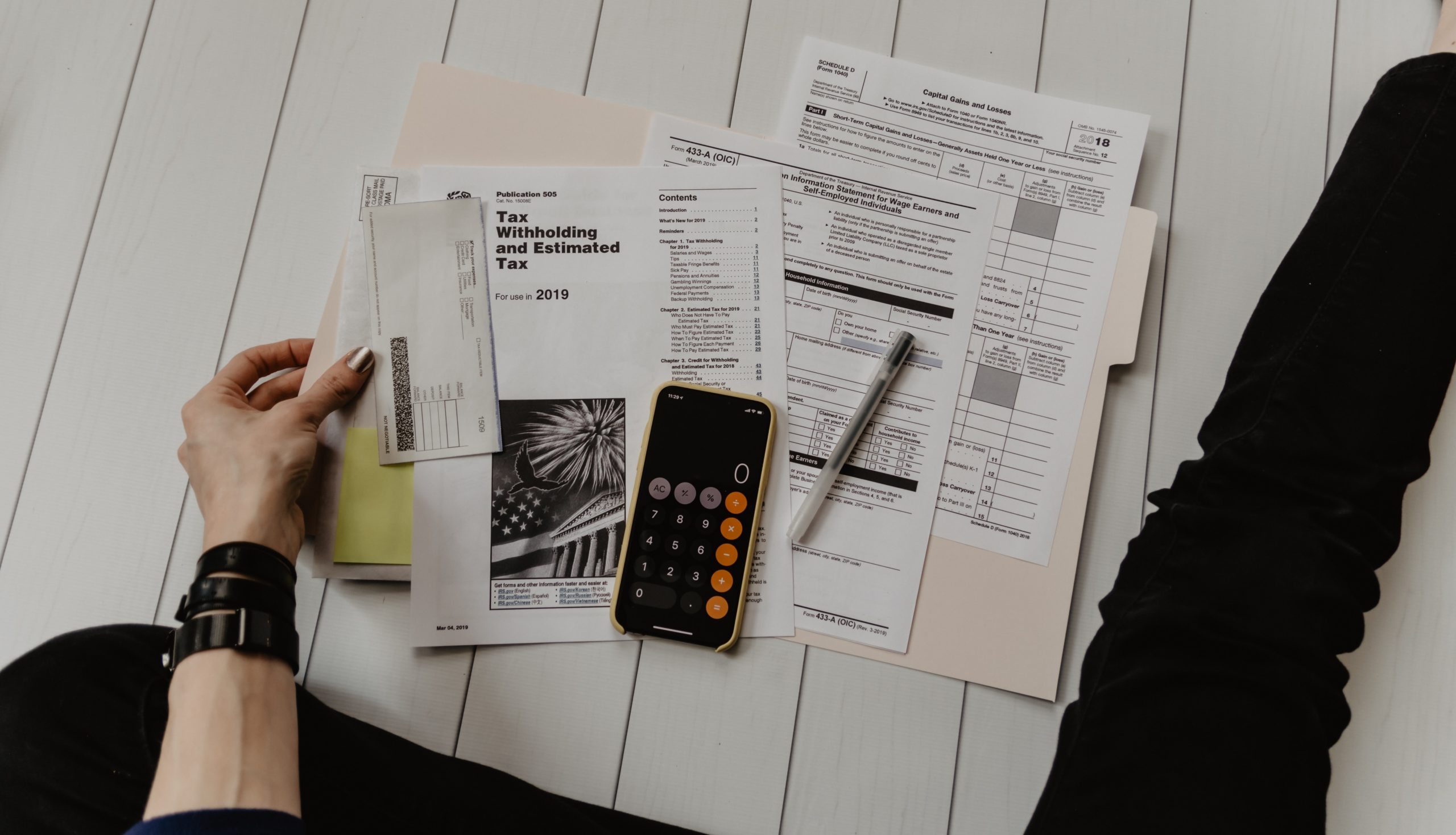 Various accounting papers for tax filing on a table.