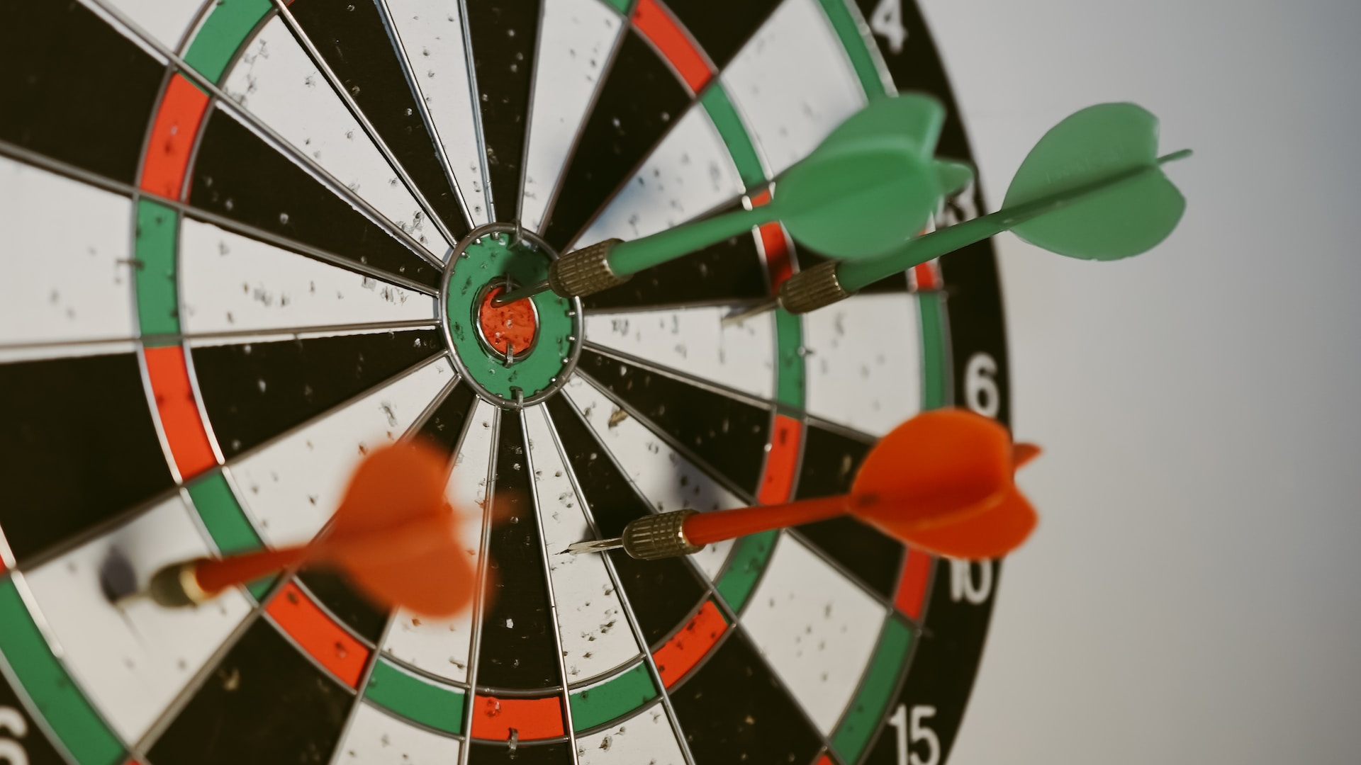 A dart board with a dart in the bullseye. 