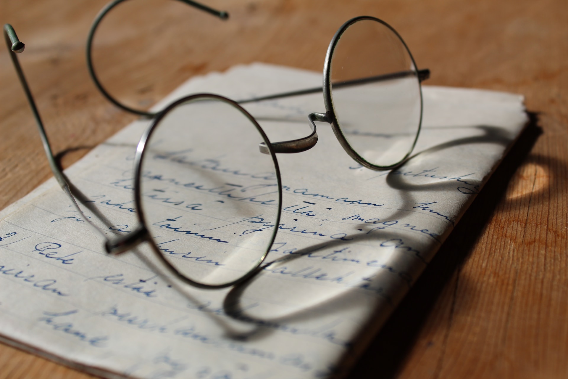 A handwritten note with eyeglasses on top.