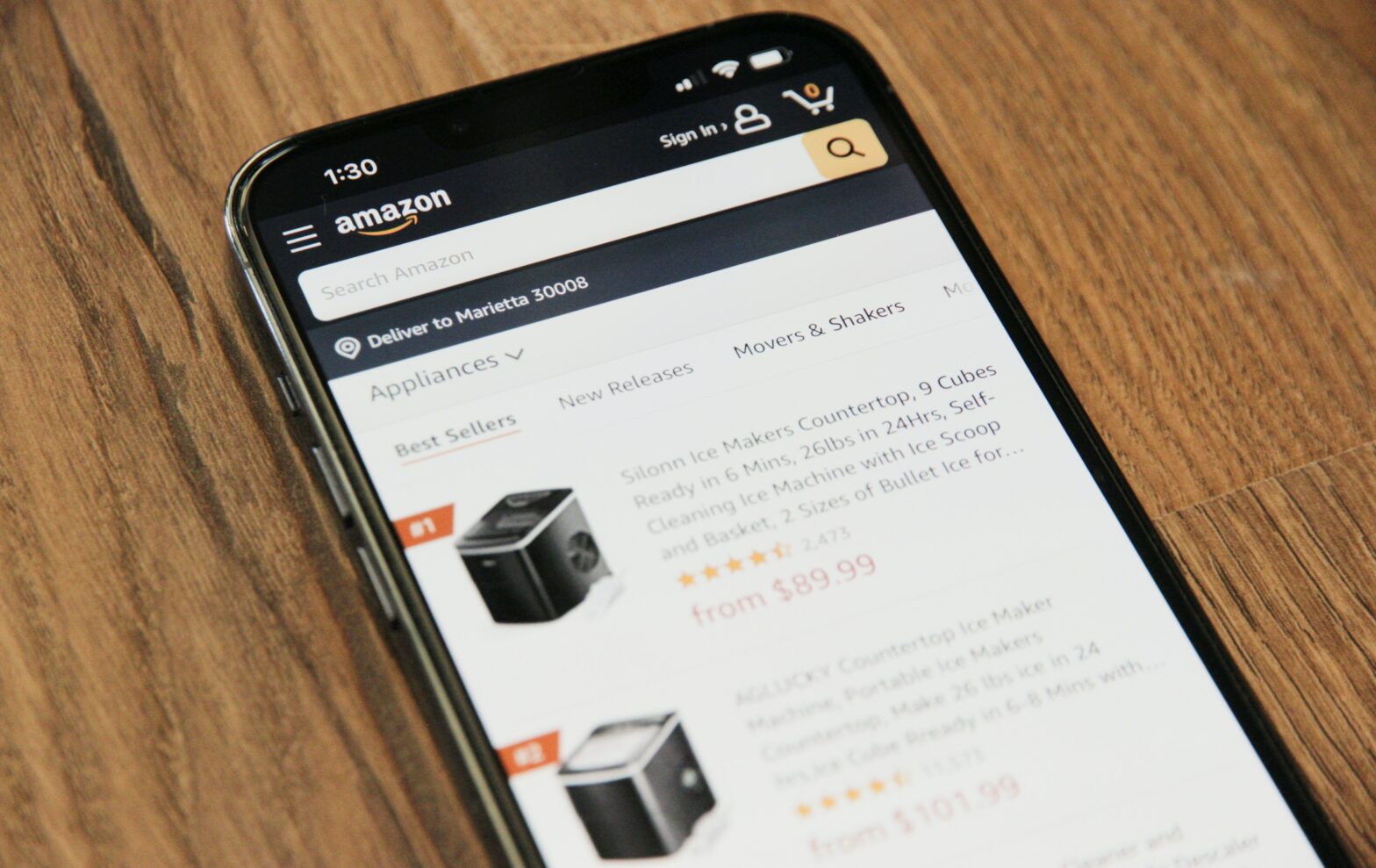 A mobile phone showing Amazon listings.